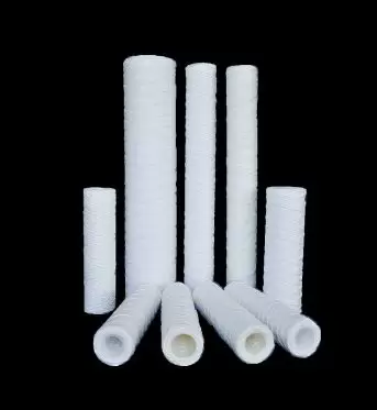Home 11 Imagem de filtros bobinados em fio de algodão utilizados em processos industriais.